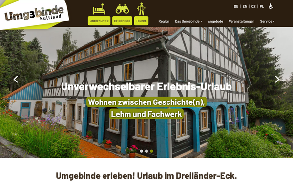 Notebook-Ansicht der Umgebinde-Kultland.de Website mit kulturellen Events und Informationen